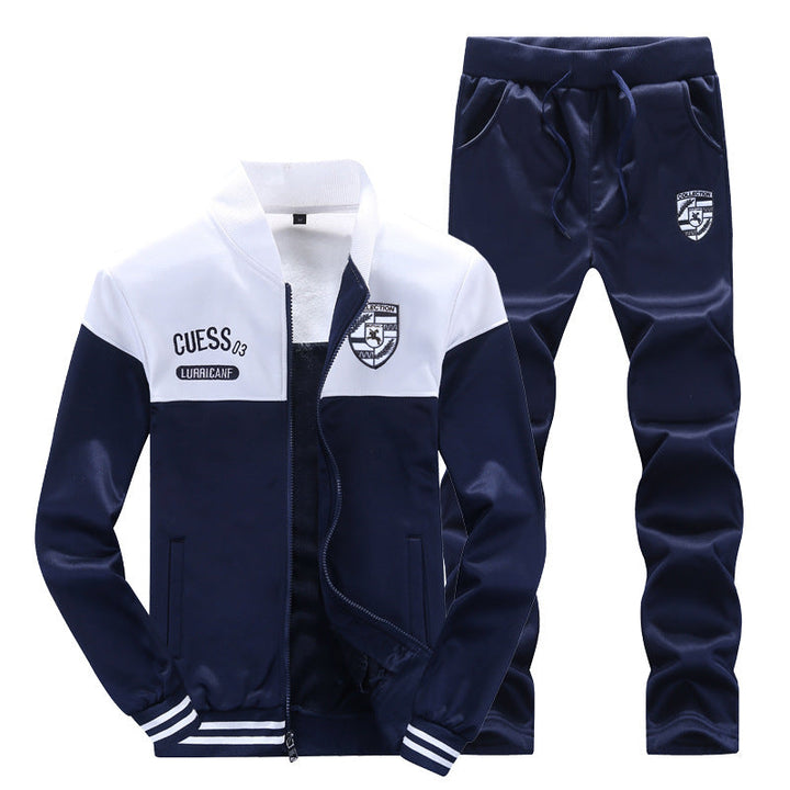 Sporty men's white & blue two-piece tracksuit. Baseball style activewear set, ideal for jogging & casual fashion.