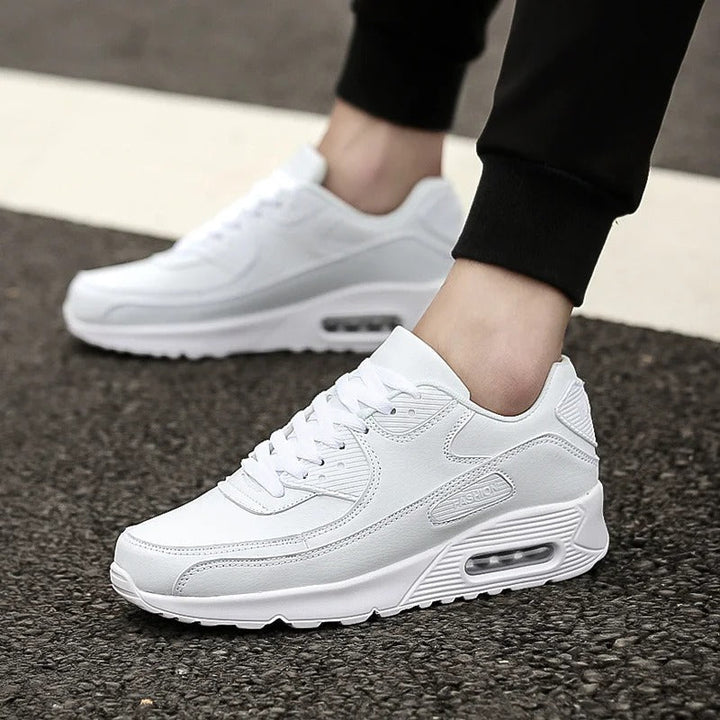Men's white cushioned sole trainers for comfortable everyday wear & stylish street fashion.
