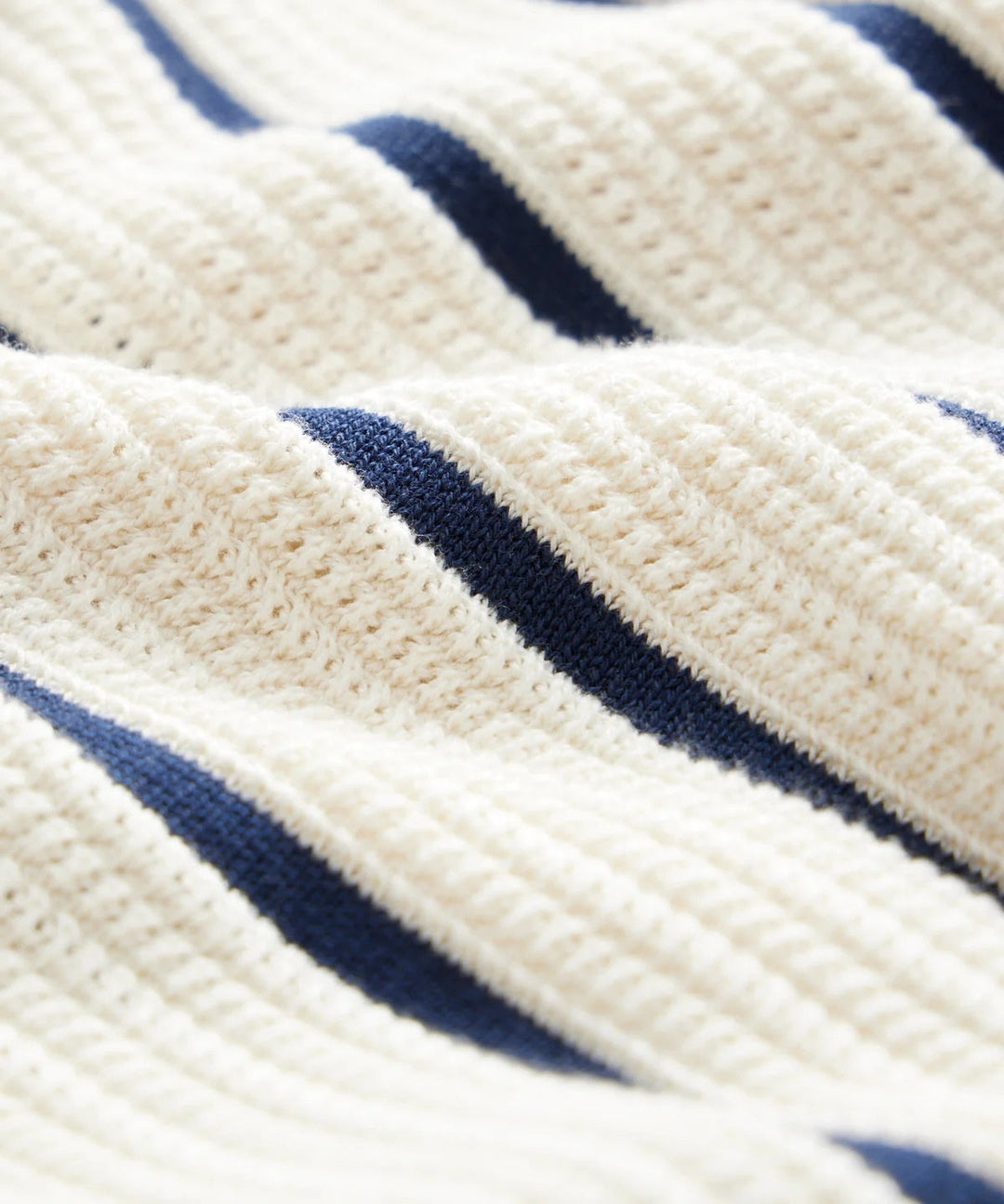 Close-up of a men's white vertical striped short sleeve button-down shirt, casual style.