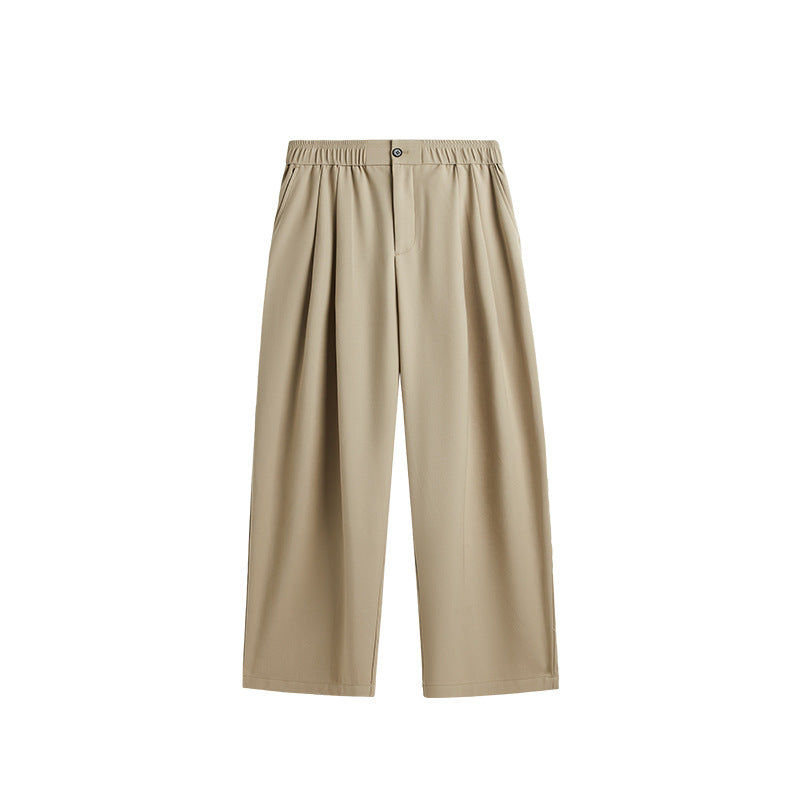 Men's pleated wide leg chino pants with a comfortable drawstring waist; ideal for stylish casual wear.
