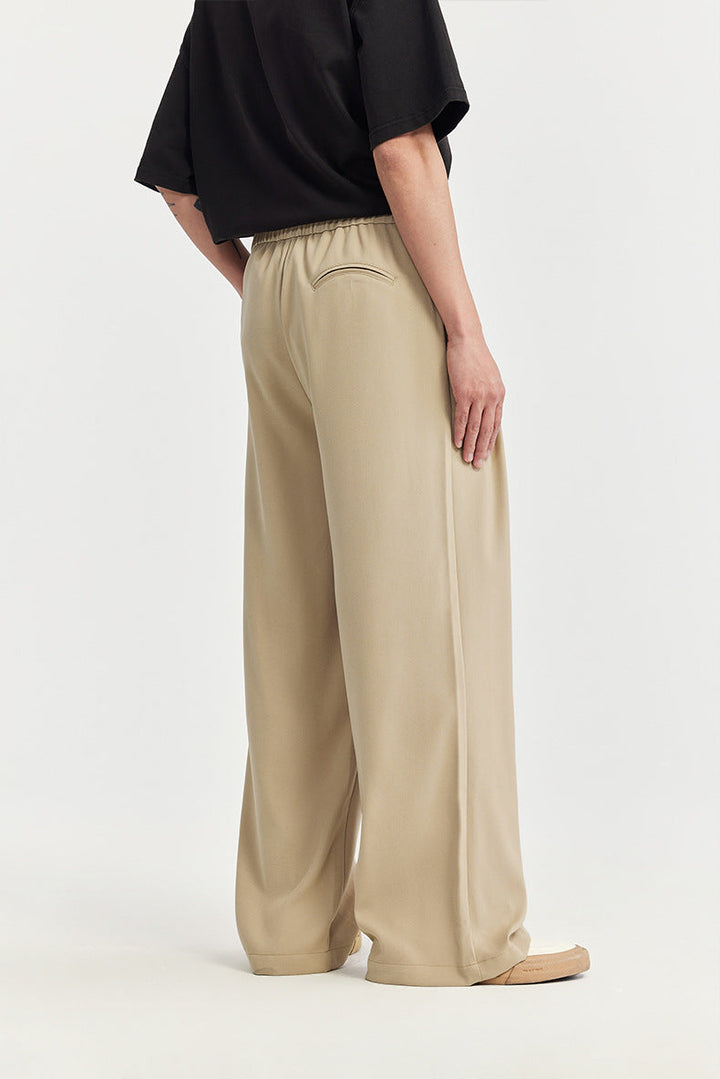 Man wearing comfortable wide leg drawstring pants, perfect for relaxed casual outings. Stylish loose fit.
