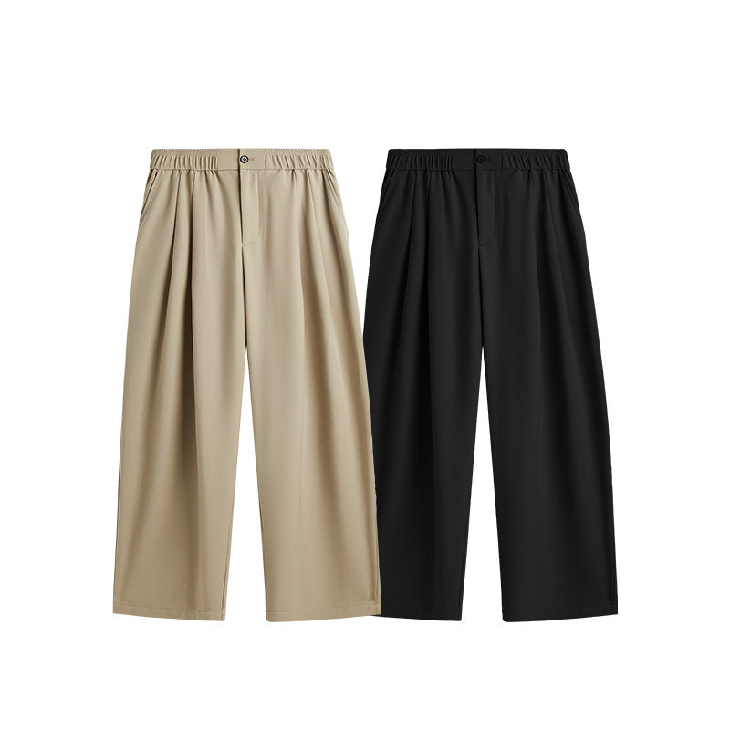 Adjustable drawstring waist on men's wide leg pleated trousers for a custom, comfortable loose fit. Chino.