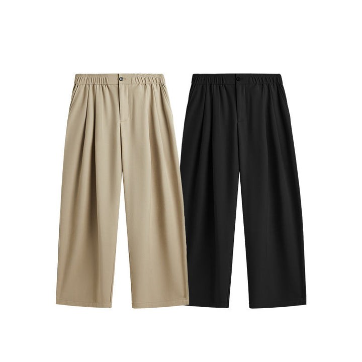 Adjustable drawstring waist on men's wide leg pleated trousers for a custom, comfortable loose fit. Chino.