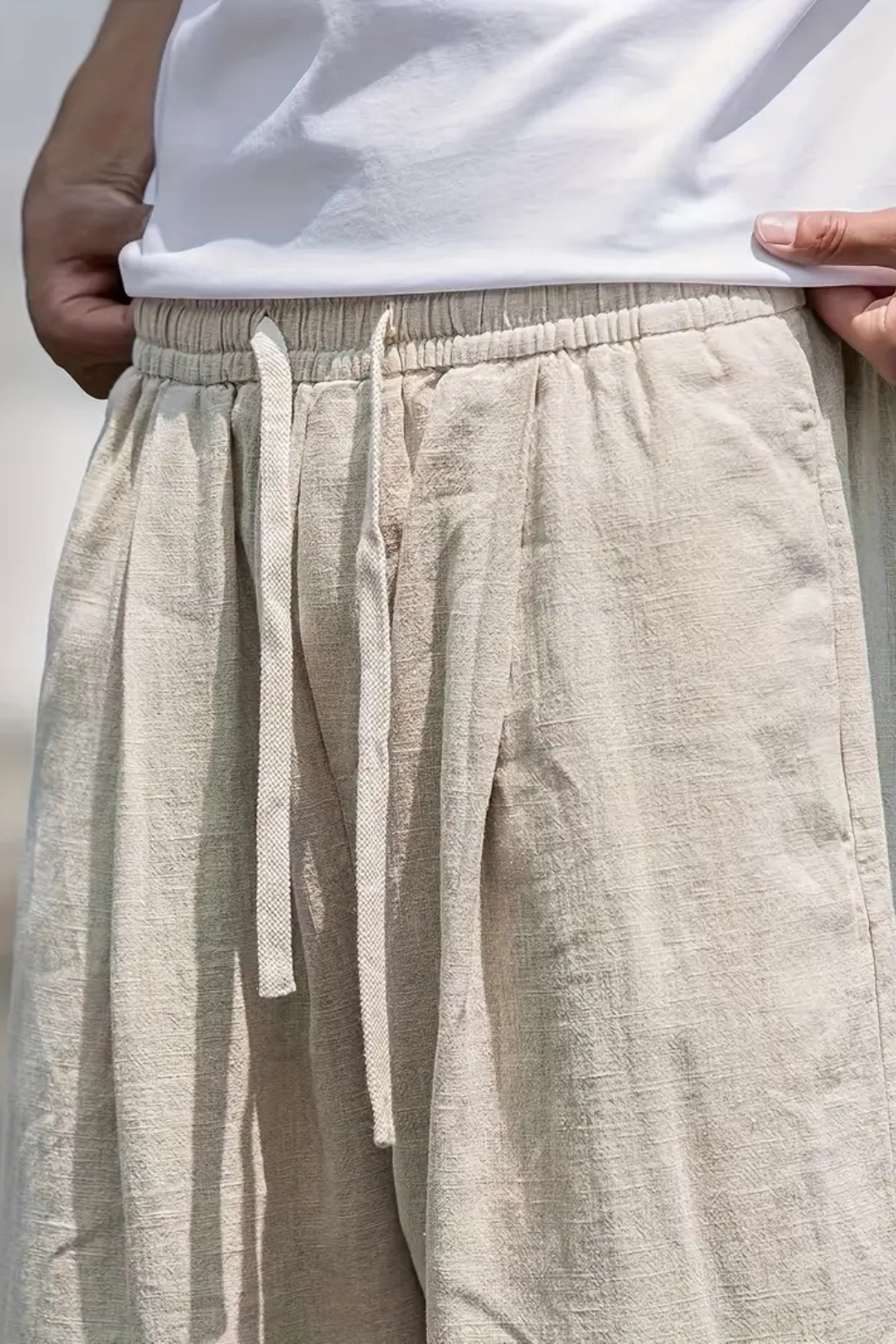 Comfortable men's wide leg casual trousers in khaki with elastic waist & drawstring, ideal for relaxed fashion.