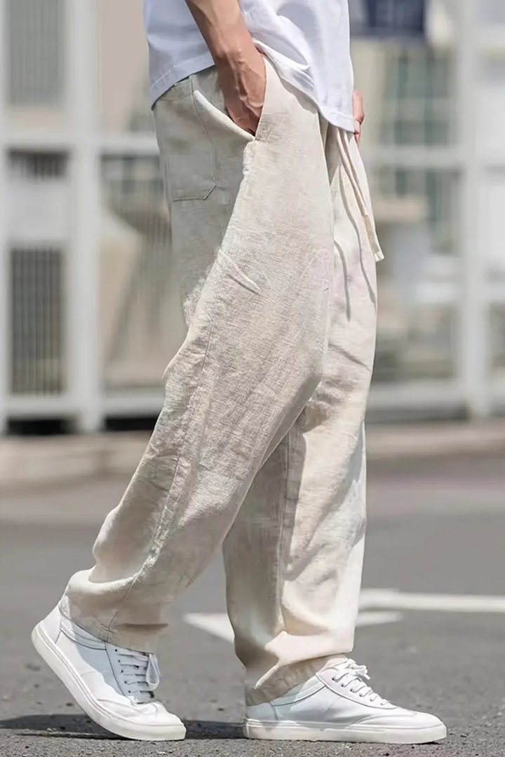 Khaki wide leg men's pants with elastic drawstring waist. Casual, comfortable bottoms with stylish front seam.