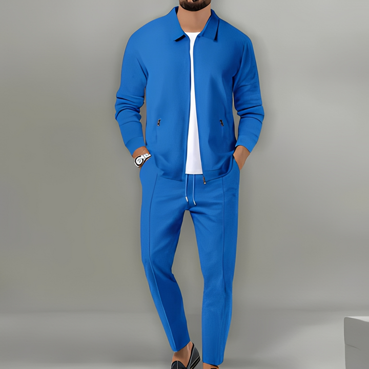 Men's zip-up tracksuit with a sleek jacket & comfortable pants. Ideal for casual or sportswear.