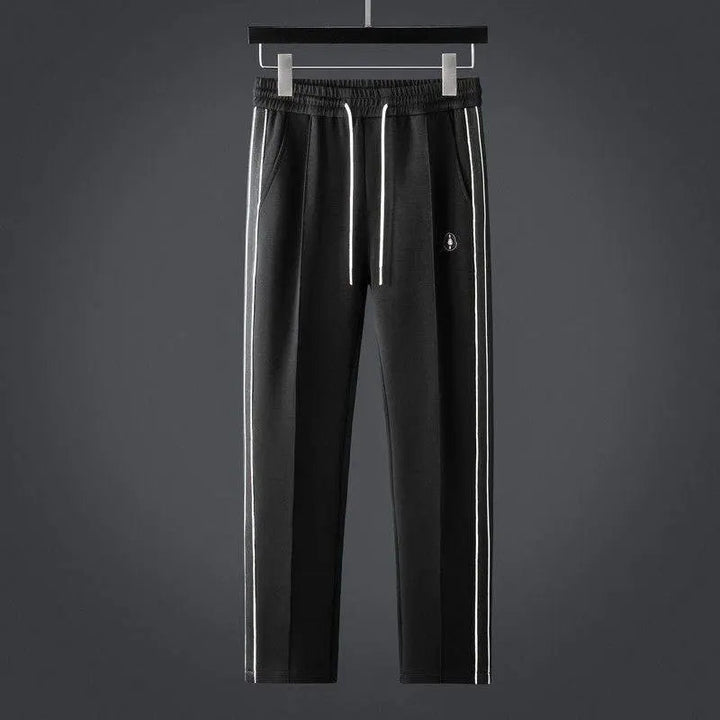 Men's coordinated activewear set: full-zip jacket & performance joggers for workouts, travel, or daily comfort.