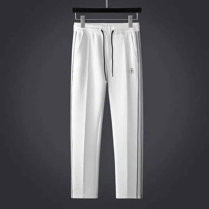 Durable men's active tracksuit set: zip-up jacket & joggers, designed for workouts, sports, and athletic comfort.