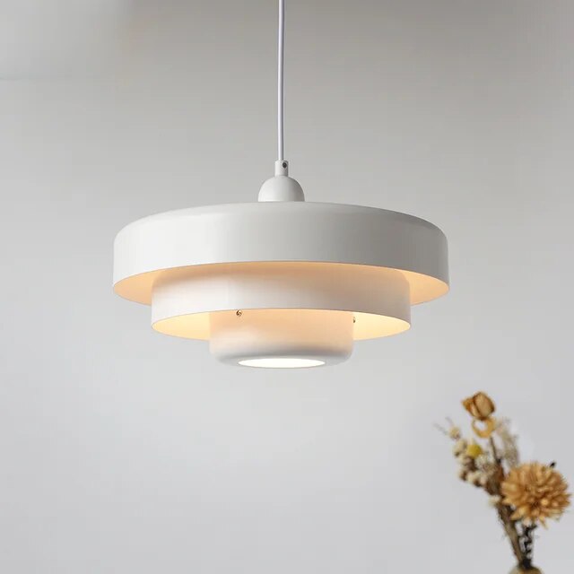 "Mid-century industrial pendant light, vibrant colors, sleek design; perfect for modern interiors, dining rooms, and offices.