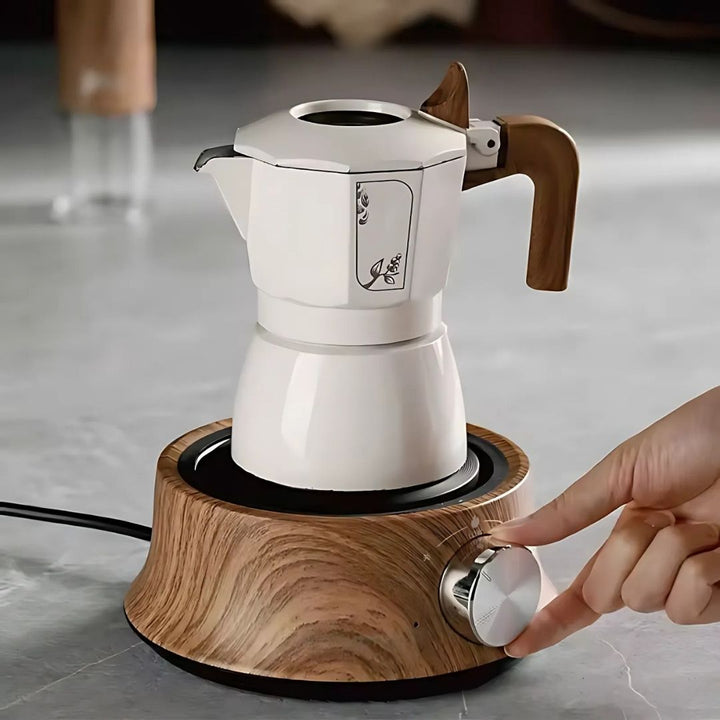 Portable mini electric hot plate, ideal for travel, dorms, & small kitchens.