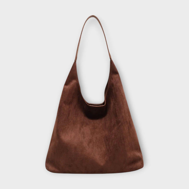 Minimalist black vegan leather shoulder bag for women, perfect for everyday casual style.