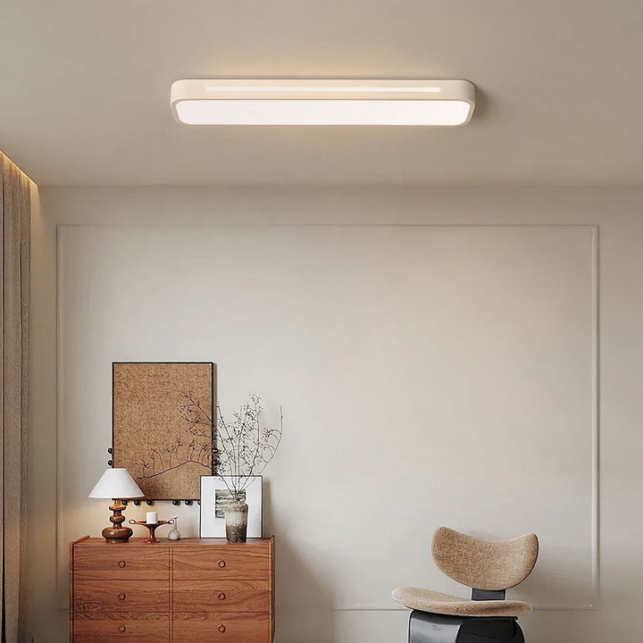 Nordic minimalist long LED ceiling light, enhancing modern interior design.