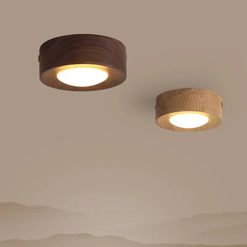 Walnut wood round LED ceiling light, featuring a minimalist design for natural, modern interior lighting. Energy efficient.
