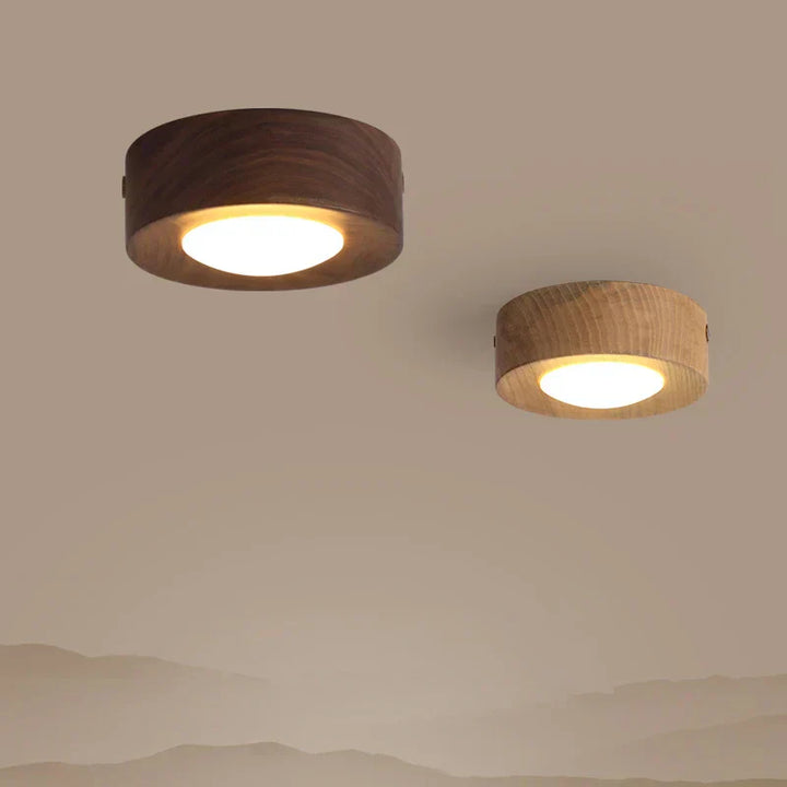Walnut wood round LED ceiling light, featuring a minimalist design for natural, modern interior lighting. Energy efficient.