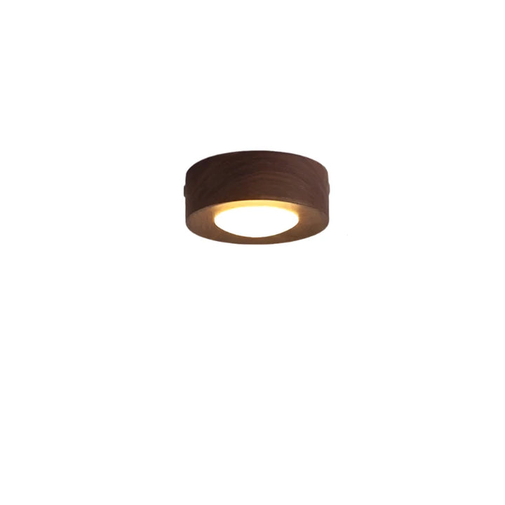 Natural walnut wood round LED ceiling light, a minimalist and modern fixture for warm, energy-efficient interior lighting.