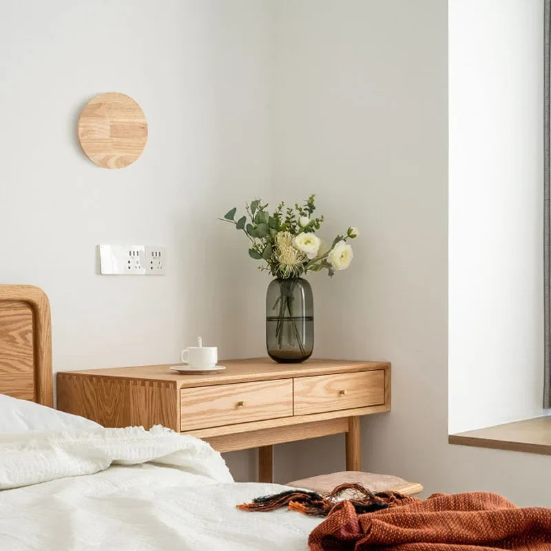 Elegant minimalist wooden wall lamp. Scandinavian design, natural wood finish, soft ambient lighting for living spaces.