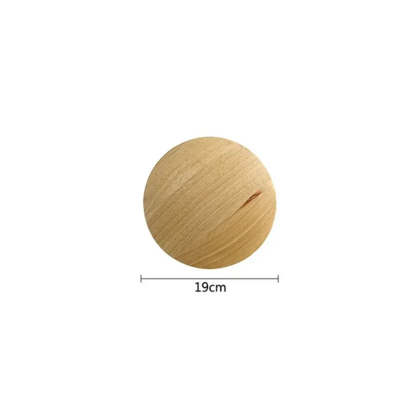 Warm ambient light from a minimalist Scandinavian wooden wall lamp. Natural wood finish, perfect home lighting.