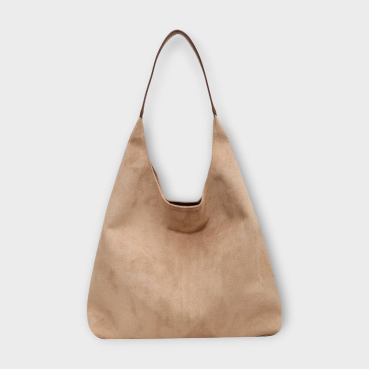 Chic and versatile women's shoulder bag in a minimalist design, great for summer fashion.