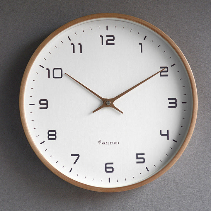 Stylish round wall clock featuring a natural wooden frame & clear glass, ideal for contemporary spaces.