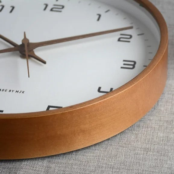Silent minimalist wall clock with a sleek wooden frame, great for quiet bedroom or office decor.