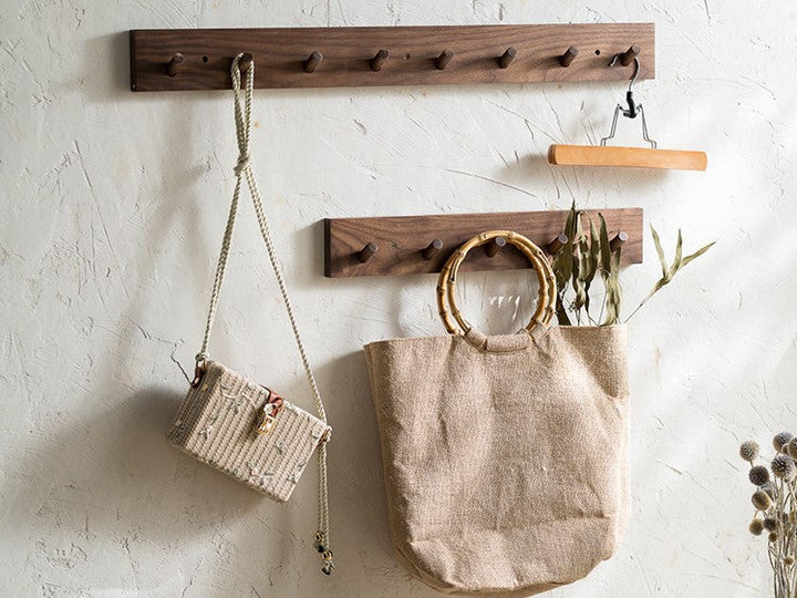 Japandi style minimalist wooden coat rack with natural wood hooks, perfect for modern home decor.
