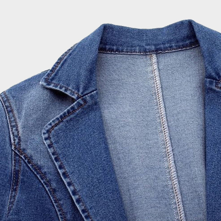 Fashionable woman posing in a new blue denim blazer, suitable for spring and autumn outerwear.