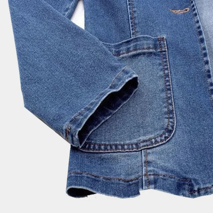 Stylish women's fitted denim blazer, a versatile fashion jacket for casual or dressed-up occasions.