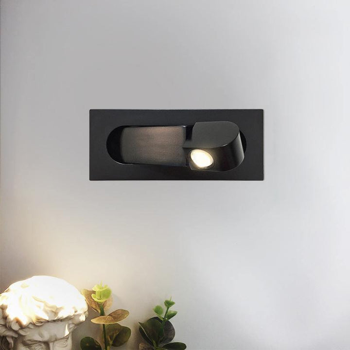 Contemporary adjustable LED reading lamp, sleek wall-mounted task light.