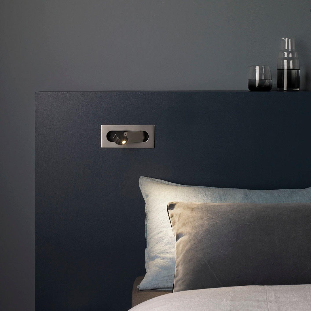 Modern LED wall lamp with flexible arm for bedside and reading convenience.