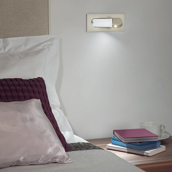 Adjustable LED wall light, perfect for contemporary home office or bedroom.