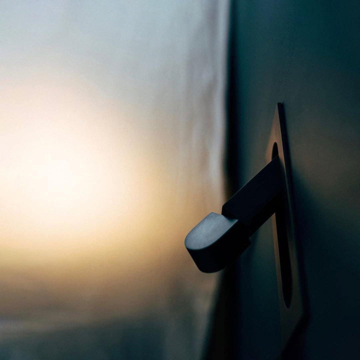 Contemporary LED wall fixture, perfect for bedside lighting and home style.