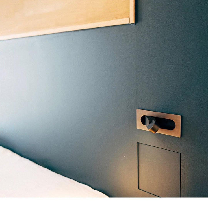 Bedroom wall lamp with adjustable LED, providing comfortable reading light.