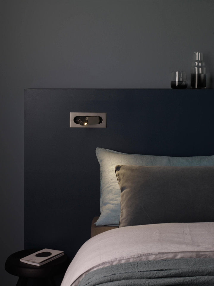 Adjustable LED wall lamp, contemporary design for bedside and reading.