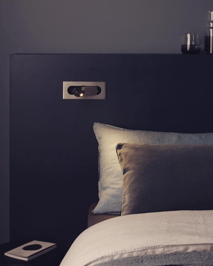 Contemporary LED wall lamp with flexible arm for optimal reading position.