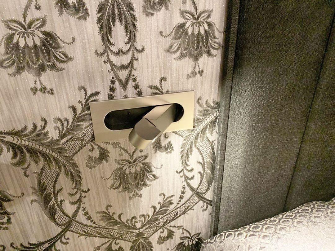 Stylish LED wall light, adjustable for bedside, modern home decor.