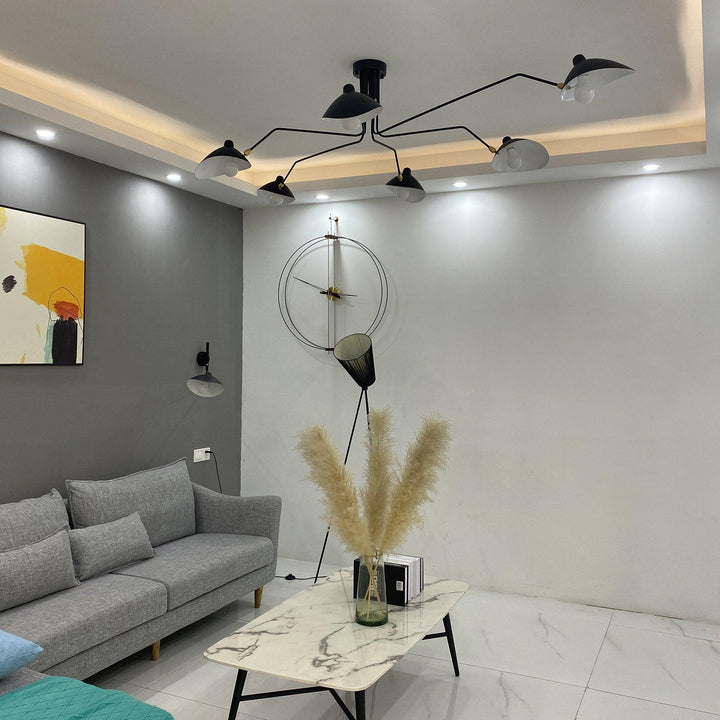 Modern adjustable multi-arm ceiling light, a designer fixture for stylish homes.