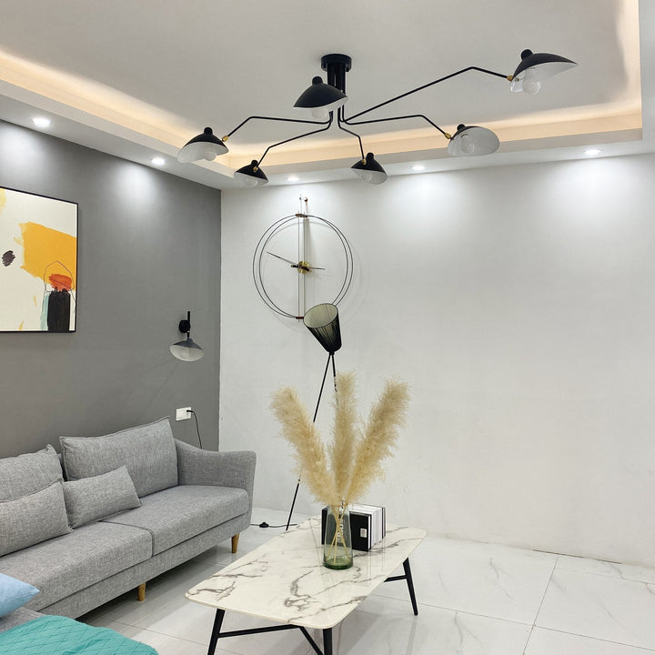 Contemporary multi-arm ceiling light, a designer fixture for adjustable illumination.