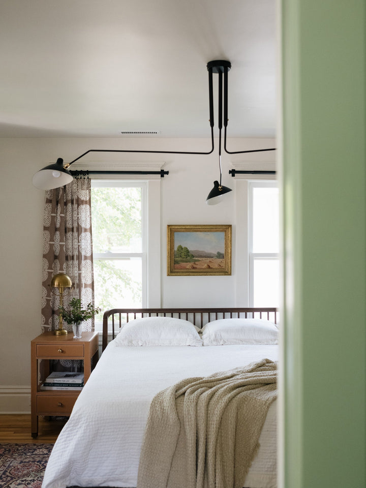 Contemporary multi-arm ceiling light, adjustable for custom living room lighting.