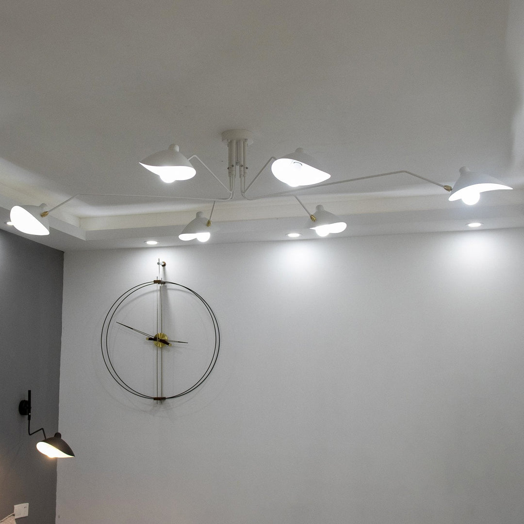 Sleek multi-arm adjustable ceiling light, enhancing modern bedrooms.