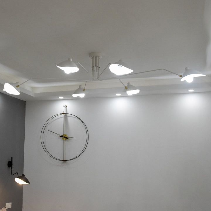 Sleek multi-arm adjustable ceiling light, enhancing modern bedrooms.