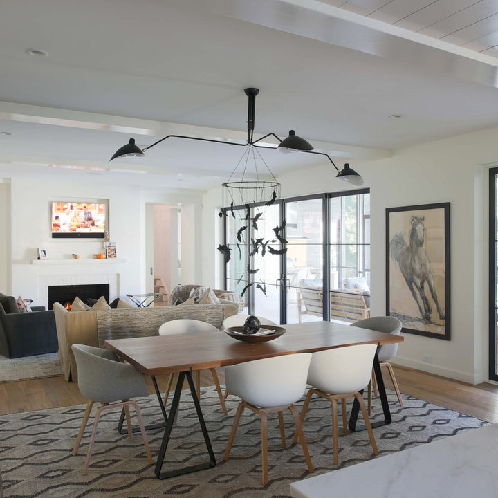 Multi-arm ceiling light, modern and adjustable for contemporary interior lighting.