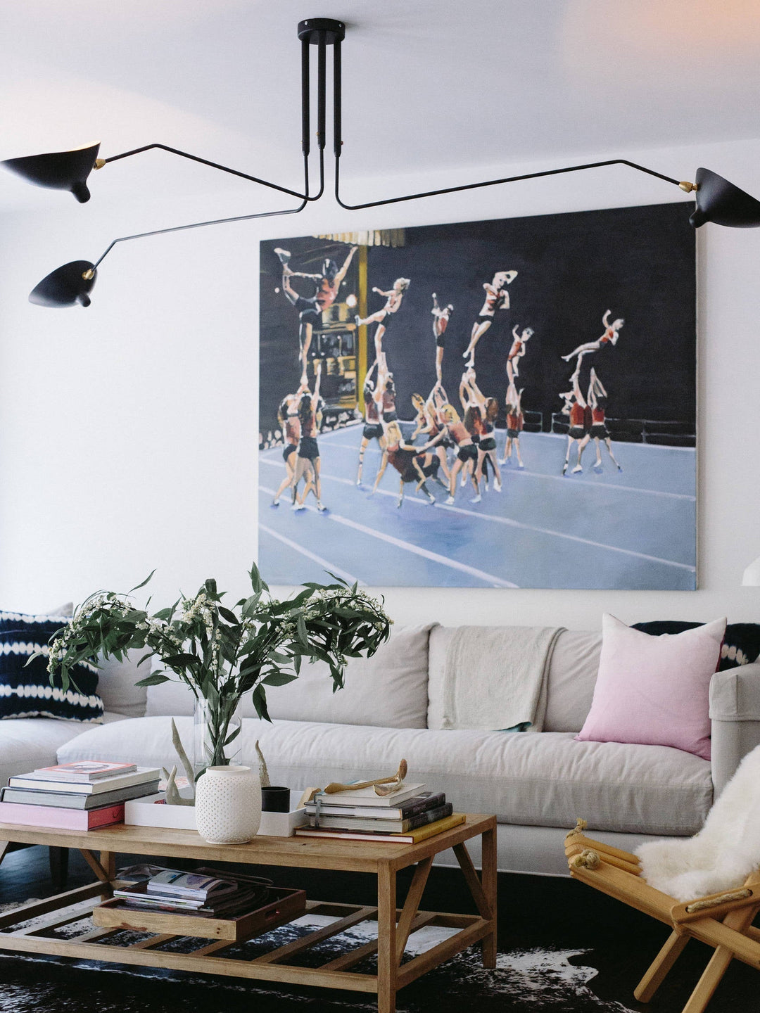 Modern adjustable multi-arm ceiling lamp, a sleek lighting solution for homes.