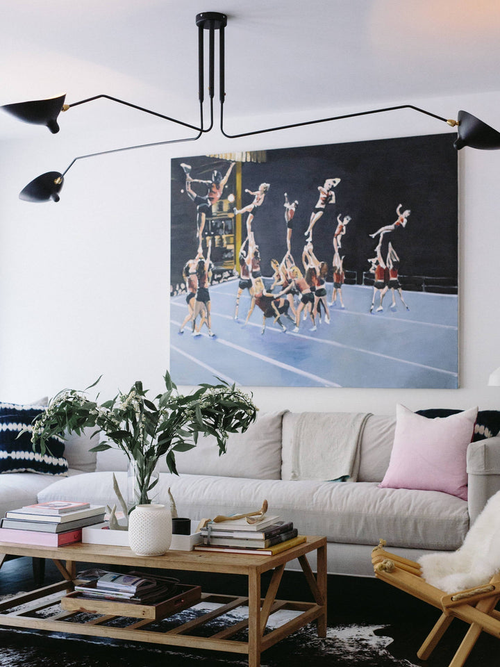 Modern adjustable multi-arm ceiling lamp, a sleek lighting solution for homes.