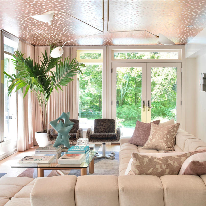 Designer multi-arm adjustable ceiling light, perfect for modern minimalist style.