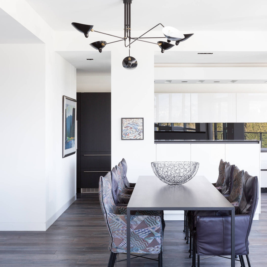 Stylish multi-arm ceiling lamp with adjustable design, great for living room lighting.