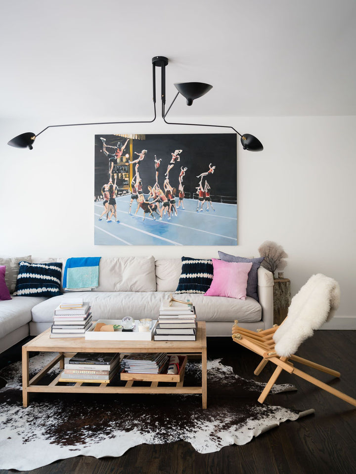 Adjustable multi-arm ceiling light, a stylish centerpiece for modern interiors.