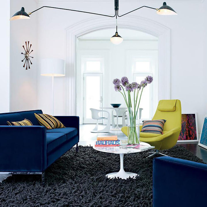 Geometric adjustable multi-arm ceiling fixture, a statement piece for modern homes.