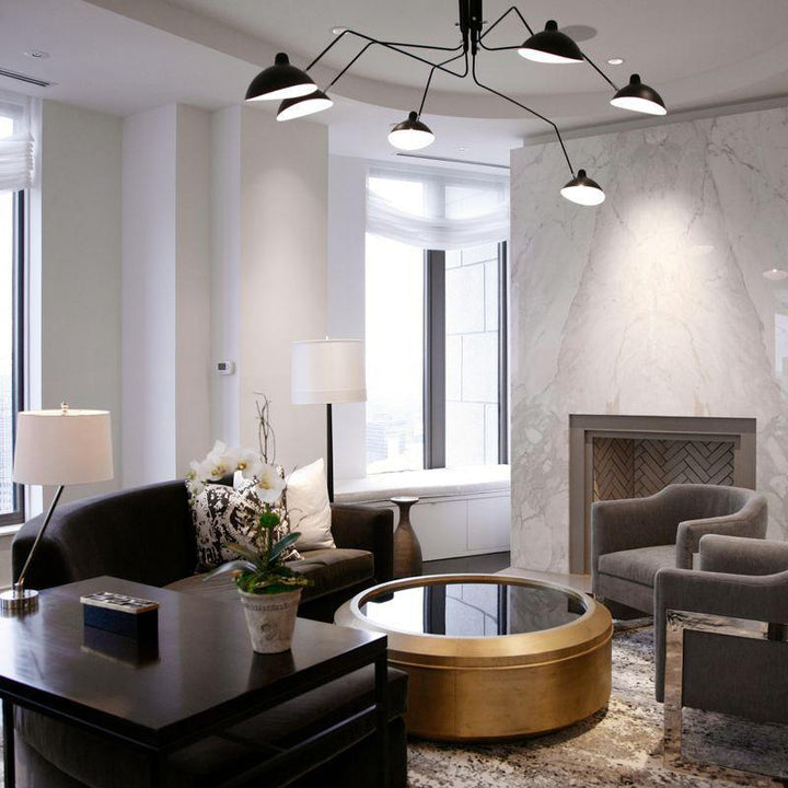 Elegant adjustable multi-arm lamp, perfect for contemporary dining areas.