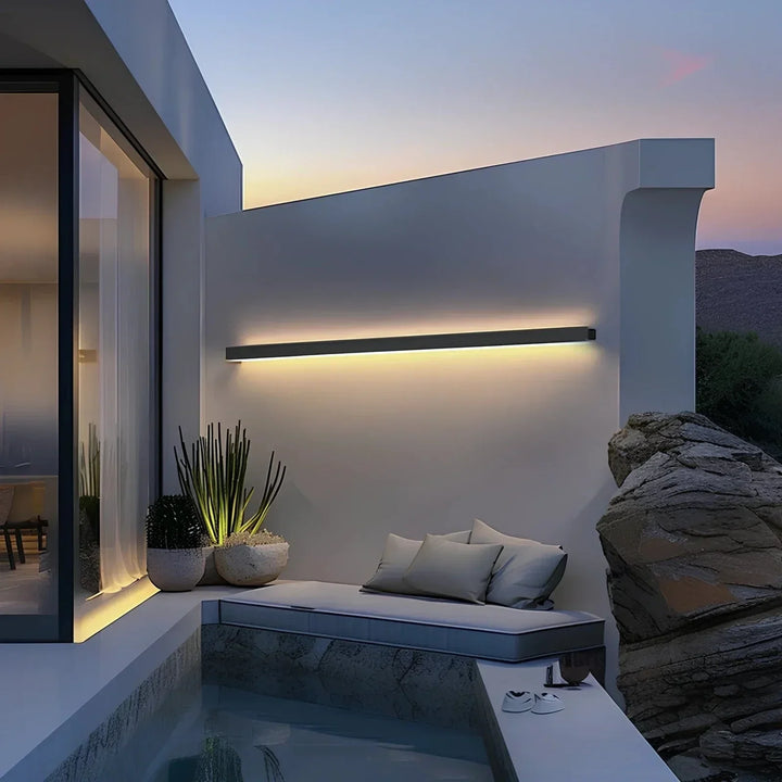 Modern LED outdoor wall sconce, a durable and energy-efficient exterior lamp for patios.