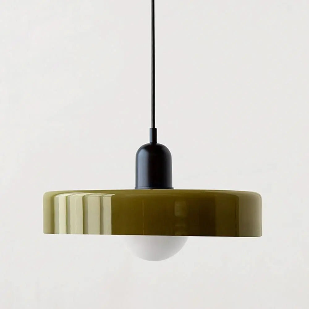 Round colored glass pendant light, modern ceiling fixture enhancing home decor.